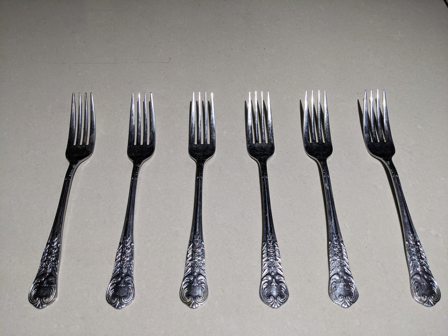 Top-down clear view of the 6-piece vintage silver-plated collectible fork set
