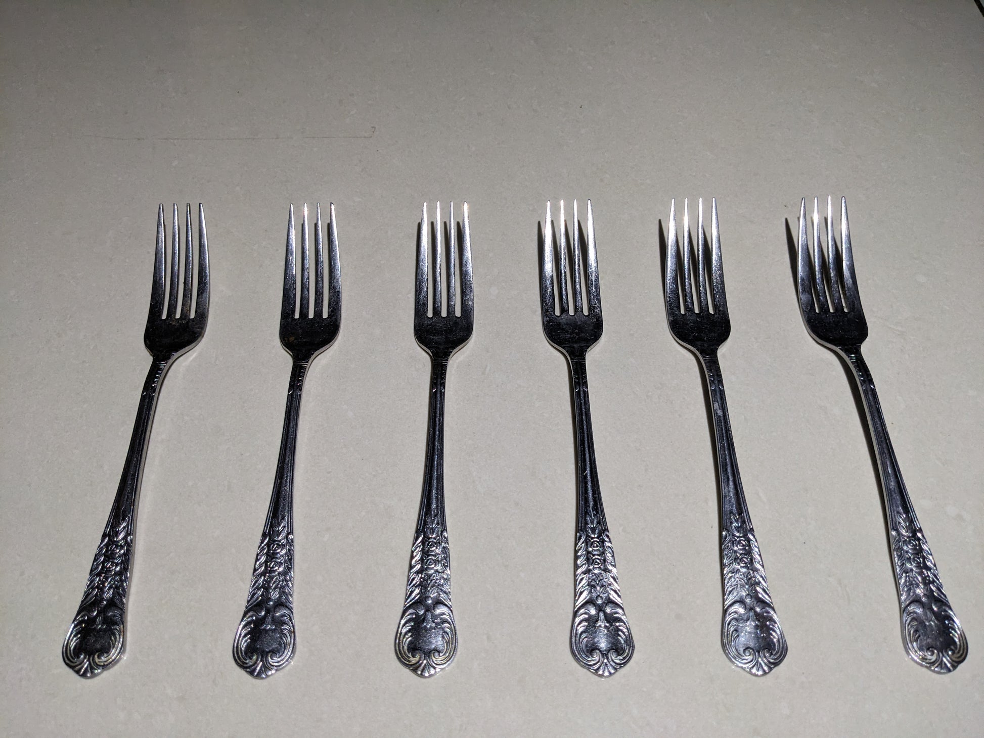 Top-down clear view of the 6-piece vintage silver-plated collectible fork set